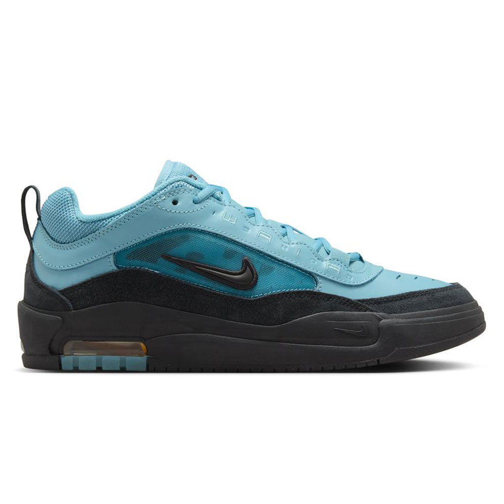 The FB2393-400 Denim Turq Black Denim Air MAX Ishod Nike SB skate shoe features suede and leather uppers, visible Max Air cushioning, a black Swoosh, and layered textures, shown on a white background.