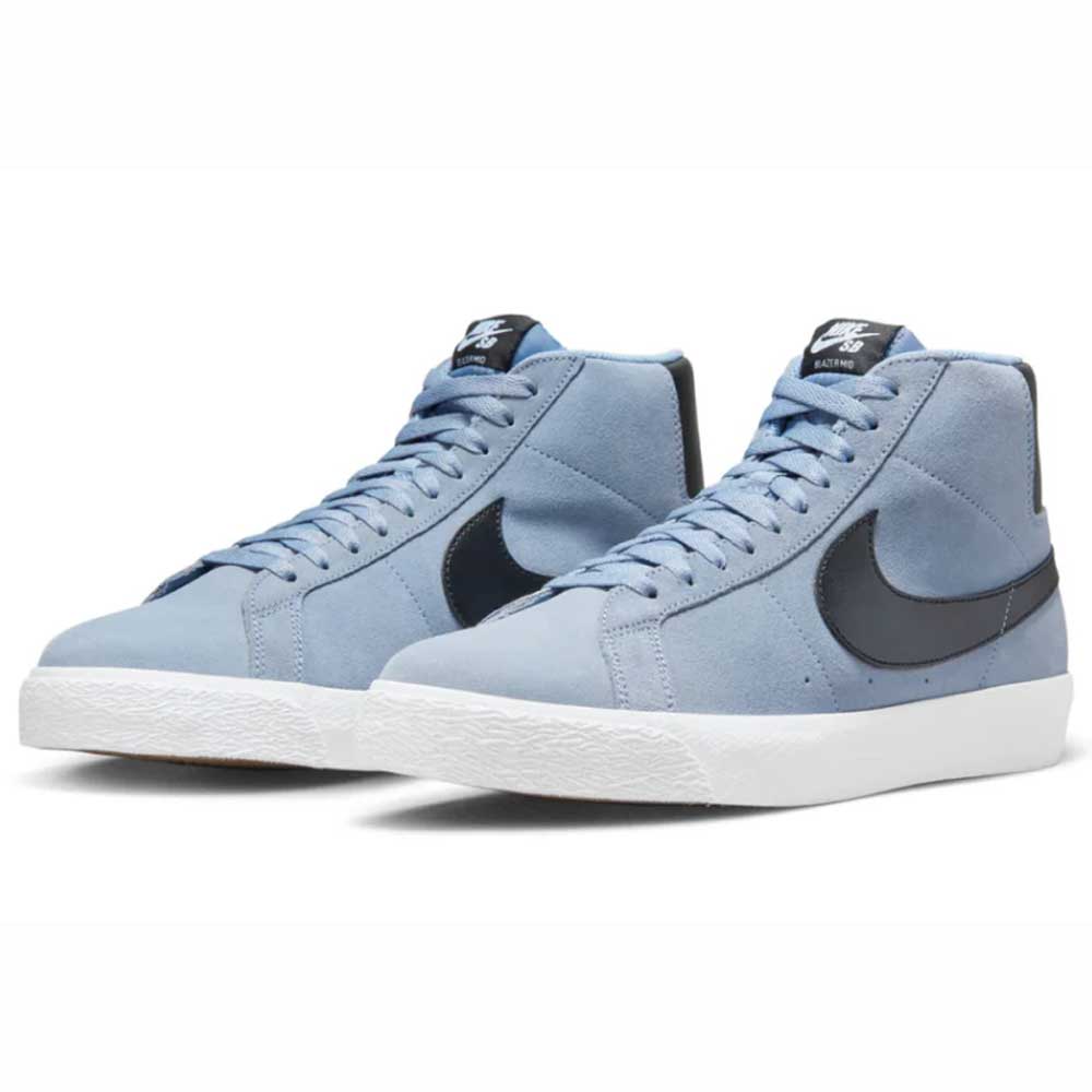 The FD0731-401 Ashen Slate Blazer Mid Nike SB Suede Shoes feature a light blue suede upper, white soles, and bold black Swoosh logos on the sides, displayed against a white background.