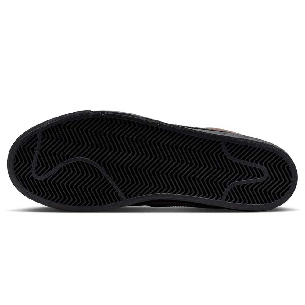 The image displays the black rubber outsole of the FD0731201 Baroque Brown Black Blazer Mid Nike SB Suede Skateboarding Shoe, featuring a herringbone traction pattern and a subtle outline of a leaping puma.