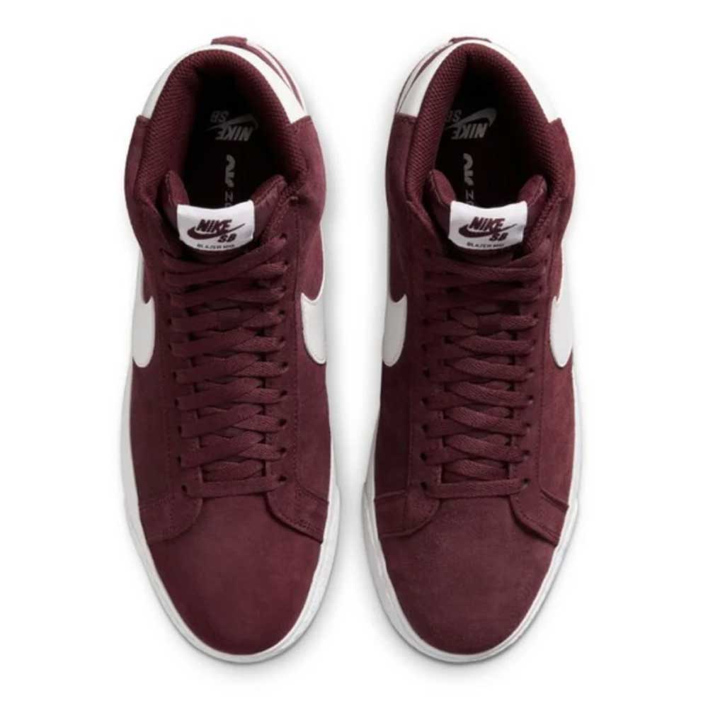 Top view of FD0731600 Burgundy Crush Summit White Blazer Mid Nike SB suede shoes, featuring white swooshes, white midsoles, and Nike SB-branded tongue labels. Shoes are laced and positioned side by side.