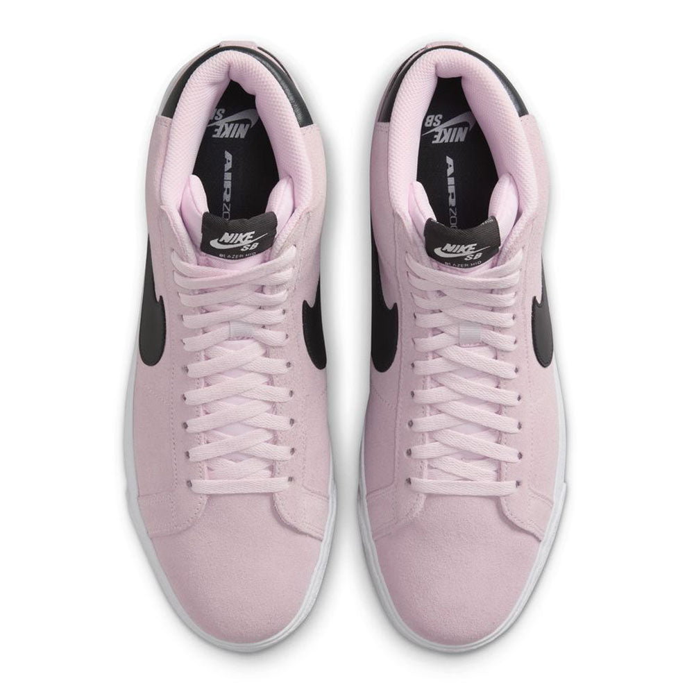 A pair of FD0731-601 Foam Anthracite White Gum Yellow Nike SB Blazer Mid suede skateboarding shoes, viewed from above, with black swooshes and heel tabs, white soles, and responsive cushioning.