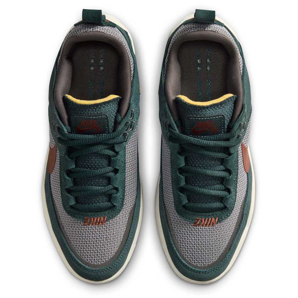 Top view of FN4210-302 Seaweed Red Sepia Medium Ash YOUTH Day One GS Nike SB Shoes: green and grey mesh uppers, green laces, orange Nike logos on tongue and toe, Zoom Air cushioning, and beige sole accents.