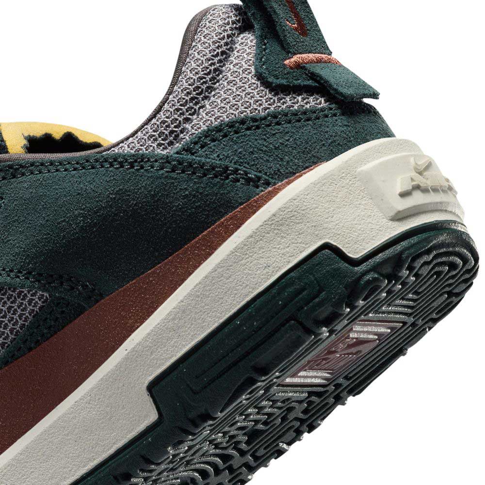 Close-up of the heel and sole of the FN4210-302 Seaweed/Red Sepia/Medium Ash YOUTH Day One GS Nike SB shoes, highlighting textured mesh, suede details, a patterned rubber outsole, and a responsive Zoom Air unit.