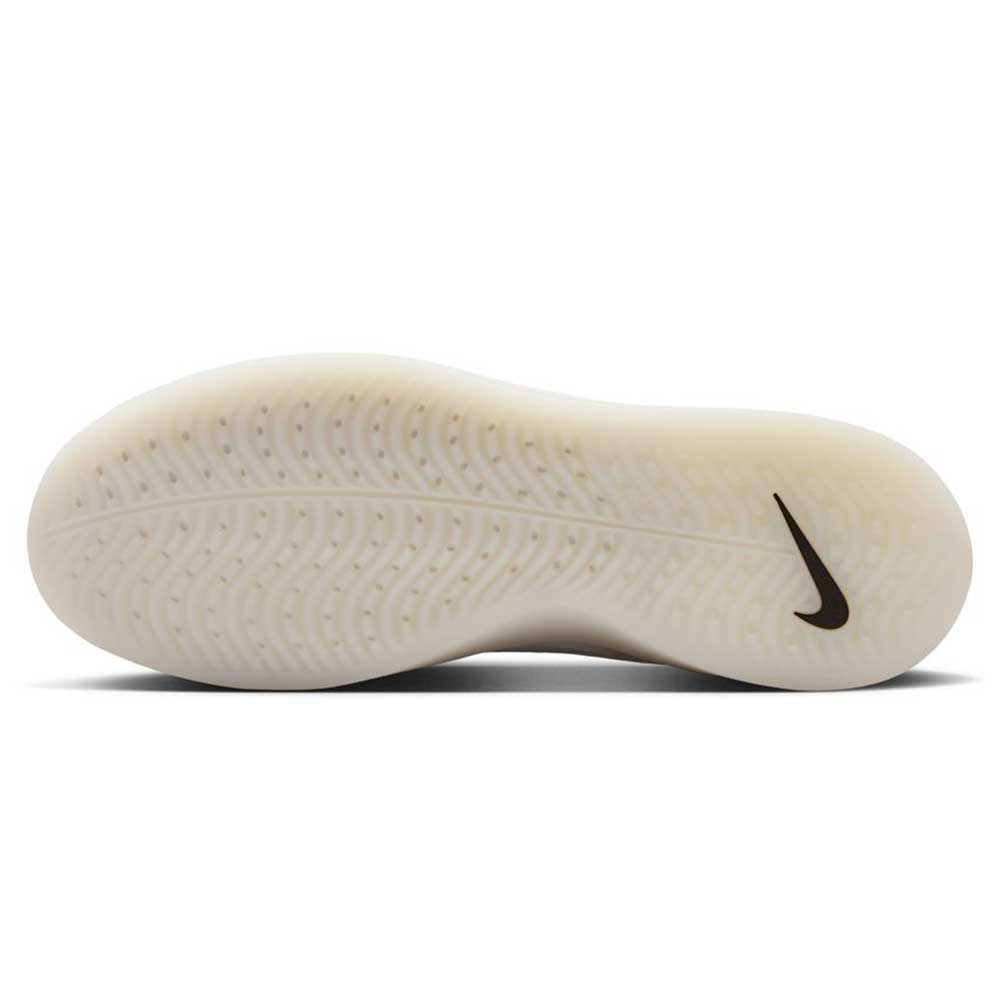 A close-up of the FQ1273-100 White Black Zoom Nyjah 4 Nike SB Skateboarding Shoes shows the light sole with a wavy tread and black Nike swoosh near the heel, emphasizing the HART outsole for enhanced durability.