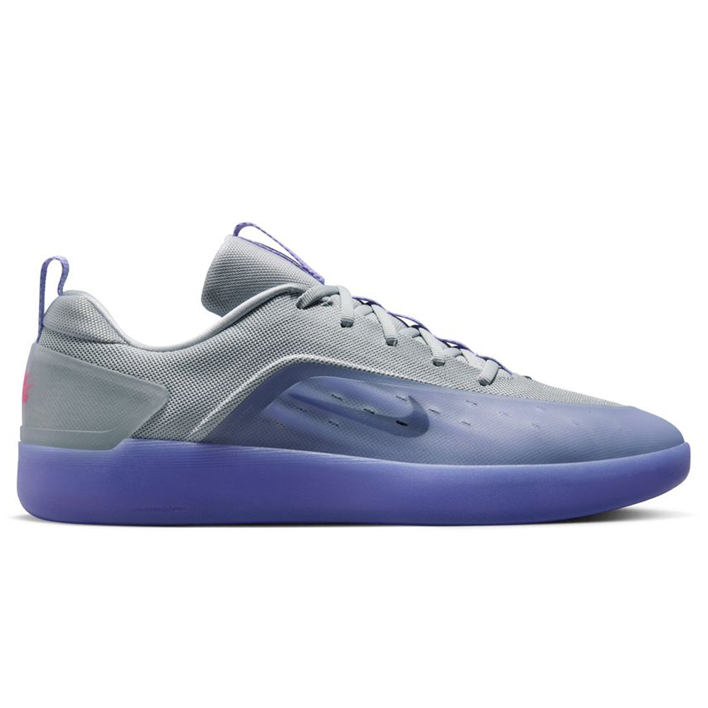 The FQ1273500 Light Thistle Black Zoom Nyjah 4 Nike SB Skateboarding Shoe features a grey mesh upper, Air Zoom cushioning, purple sole and accents, subtle Nike swoosh, matching laces, and a heel loop for easy wearing.
