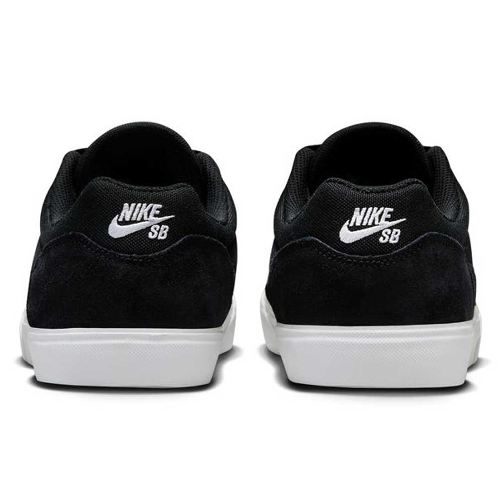 The FV6064001 Black White Malor Nike SB Suede Skateboarding Shoes feature white Nike SB logos on the heels, white rubber soles, and sleek black suede, shown from the back.