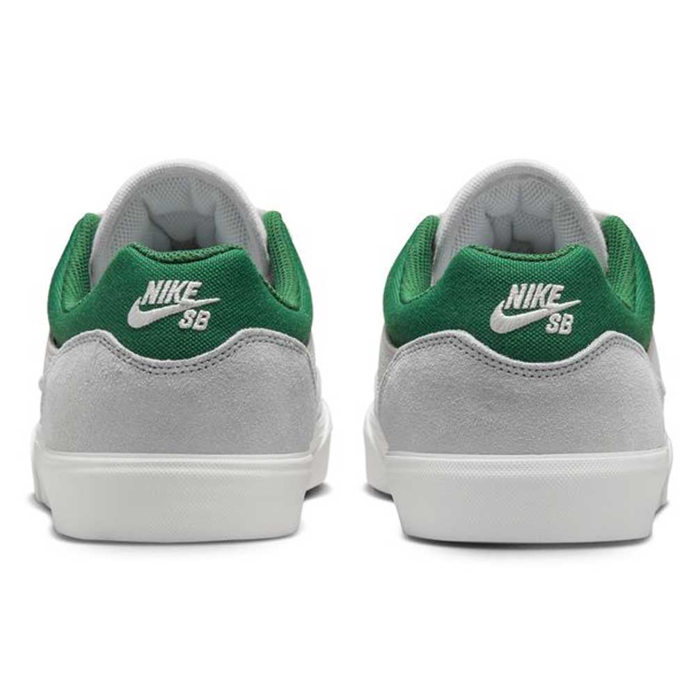 A pair of FV6064002 Platnium Fir Wolf Gray White Suede Nike SB Shoes viewed from the back, showing grey suede uppers, green accents at the heel and collar, white midsoles, and white Nike SB logos on the heels.