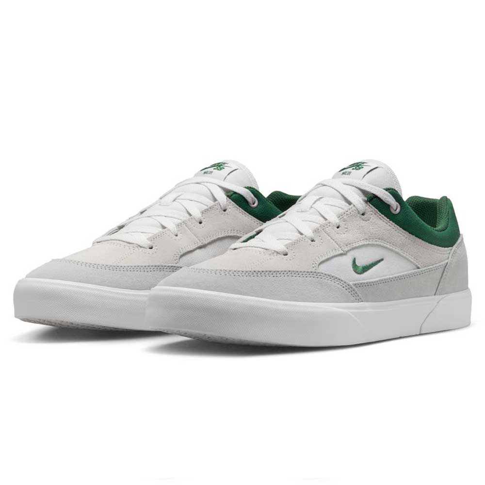 The FV6064002 Platnium Fir Wolf Gray White Suede Nike SB Shoes feature white and light gray suede with green accents, including a green inner lining and small green swoosh, displayed on a white background.