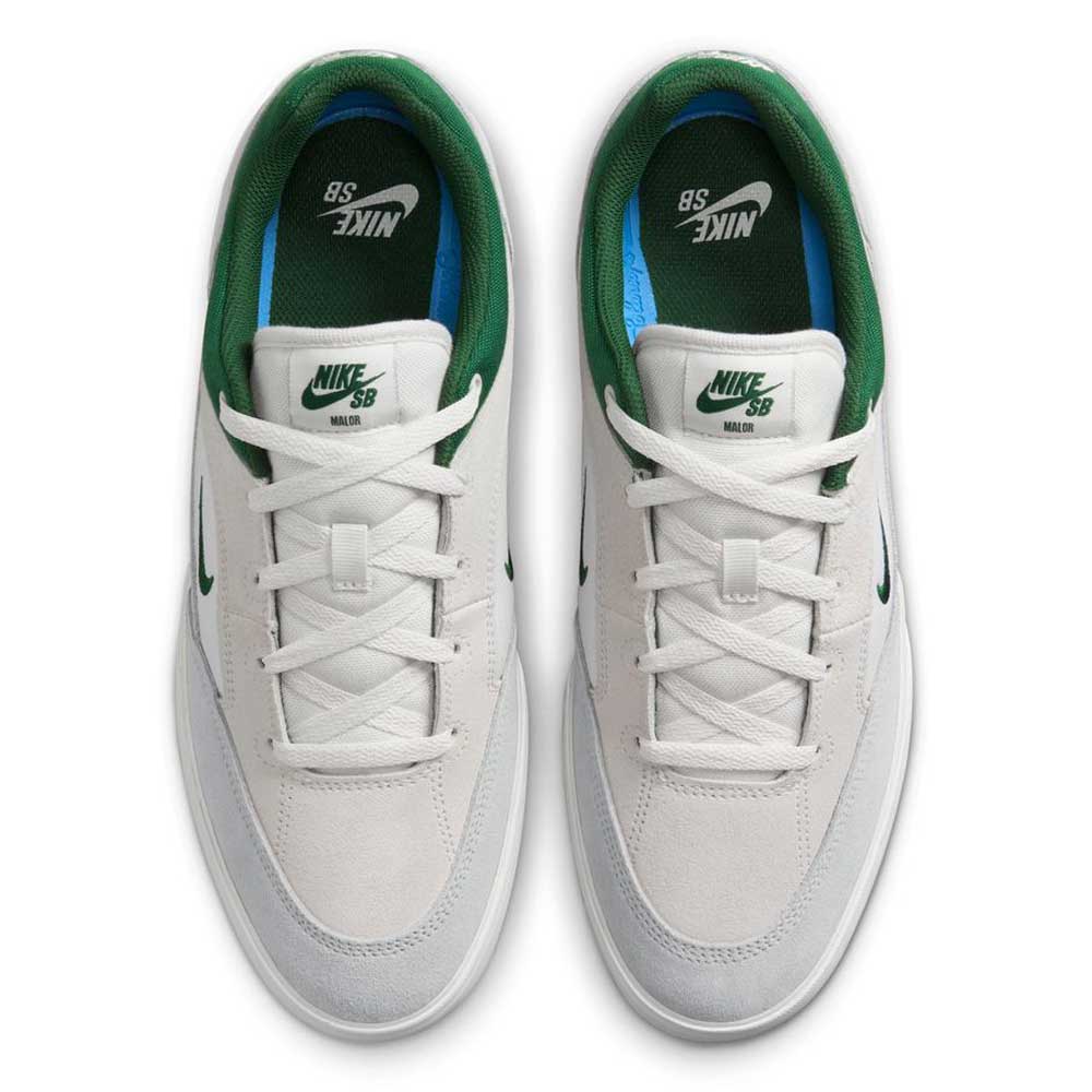 Top view of FV6064002 Platnium Fir Wolf Gray White Suede Nike SB shoes featuring white suede, green accents on the collar and tongue, green Nike logos on the insoles, and green swooshes on the sides.