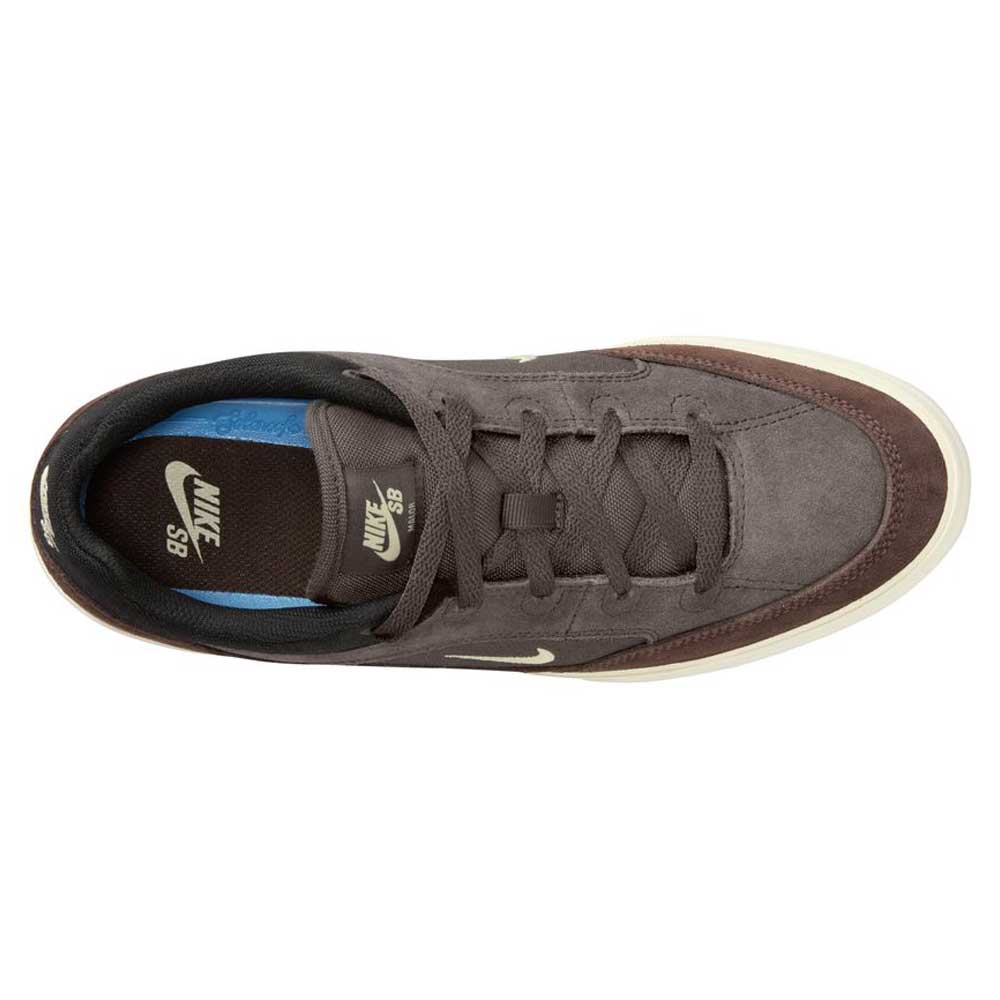 Top view of the FV6064-005 Ironstone Light Khaki Malor Nike SB suede skateboarding shoe with a brown suede finish, black inner lining, cream Nike logos, white sole, and visible blue insole.