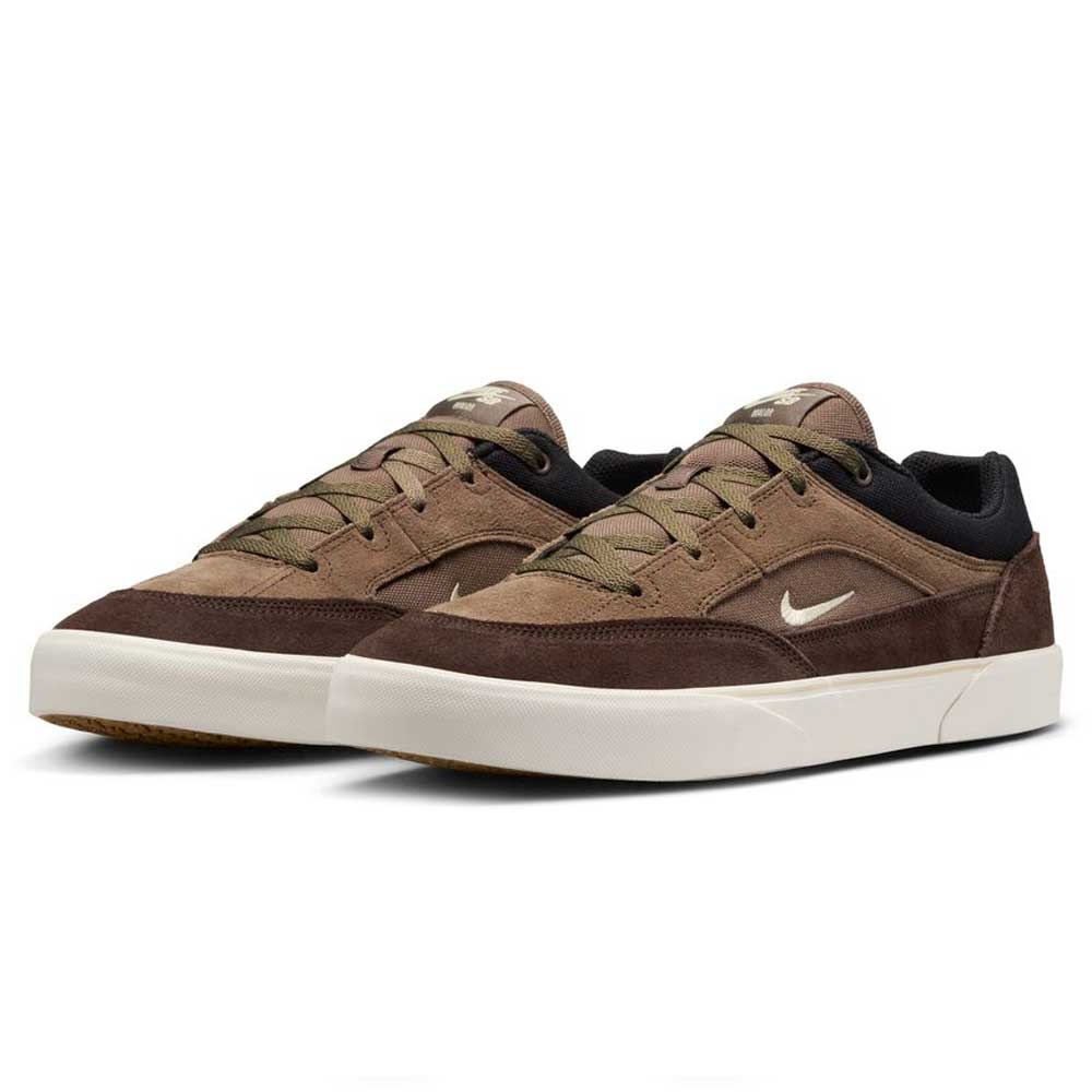 A stylish pair of Nike SB Malor FV6064-005 Ironstone Light Khaki suede skateboarding shoes featuring white soles, olive green laces, a white swoosh, and a black collar—perfect for skating in both comfort and style.