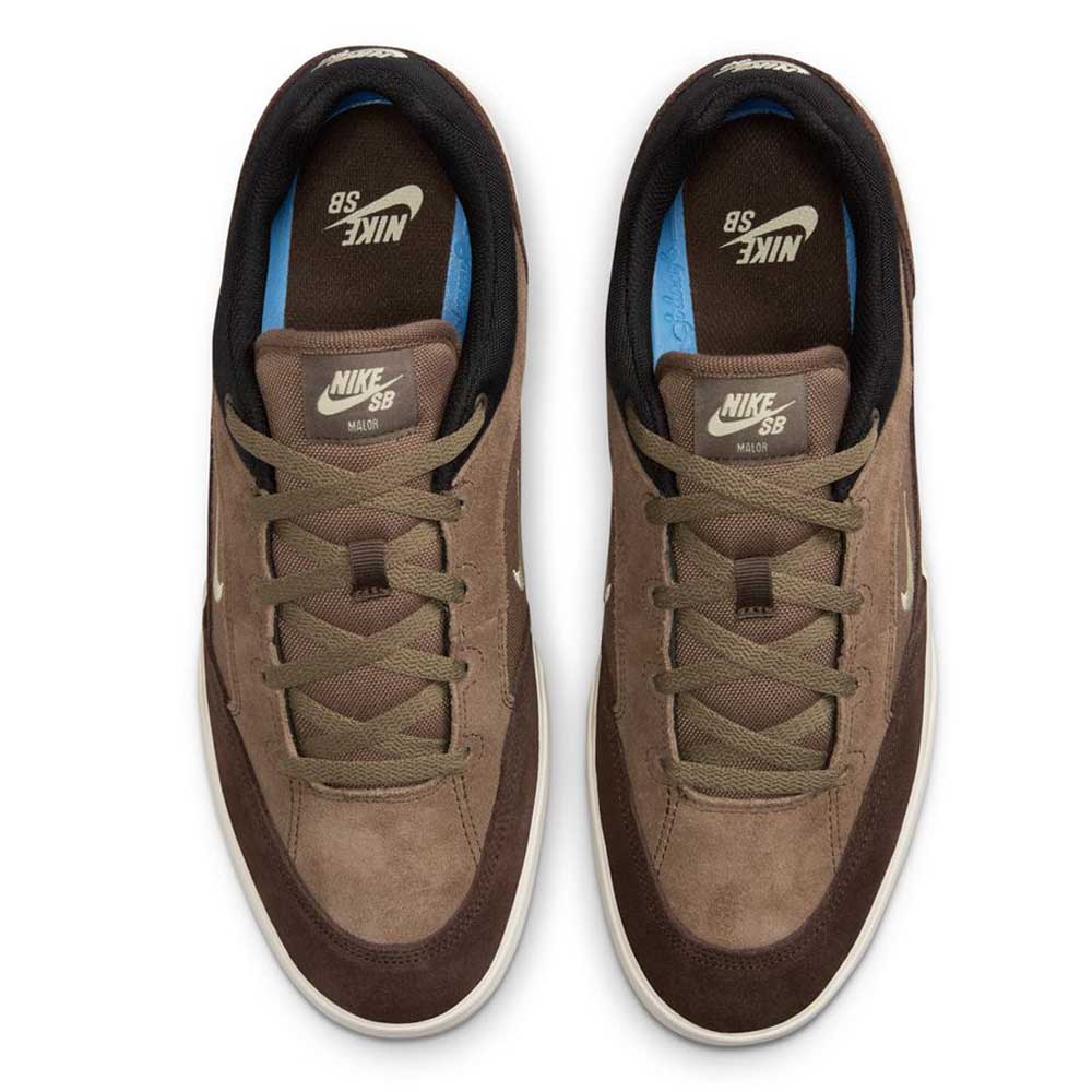 The FV6064005 Ironstone Light Khaki Malor Nike SB Suede Skateboarding Shoes feature brown suede, brown laces, black inner lining, and white Nike logos on the insoles and tongues, viewed from above.