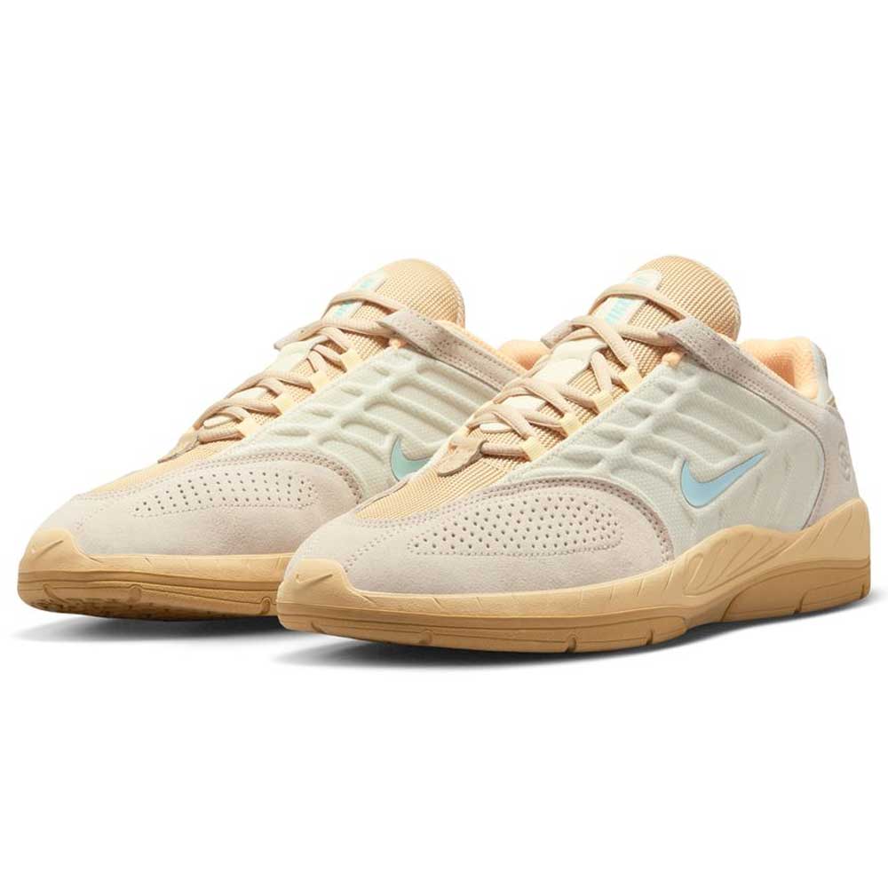 A pair of Nike SB FZ4878100 Summit Coconut Milk Jade Ice Sesame Vertebrae suede skate shoes featuring beige and light tan uppers, light blue swooshes, gum soles, and breathable mesh, displayed on a white background.