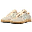 A pair of Nike SB FZ4878100 Summit Coconut Milk Jade Ice Sesame Vertebrae suede skate shoes featuring beige and light tan uppers, light blue swooshes, gum soles, and breathable mesh, displayed on a white background.