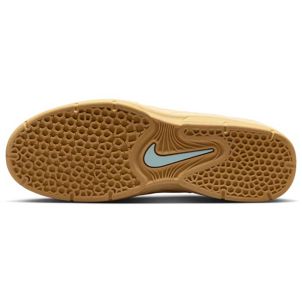 The image displays the sole of the Nike SB FZ4878-100 Summit Coconut Milk Jade Ice Sesame Vertebrae suede shoe, featuring a tan honeycomb tread pattern and a light blue Swoosh at the center.
