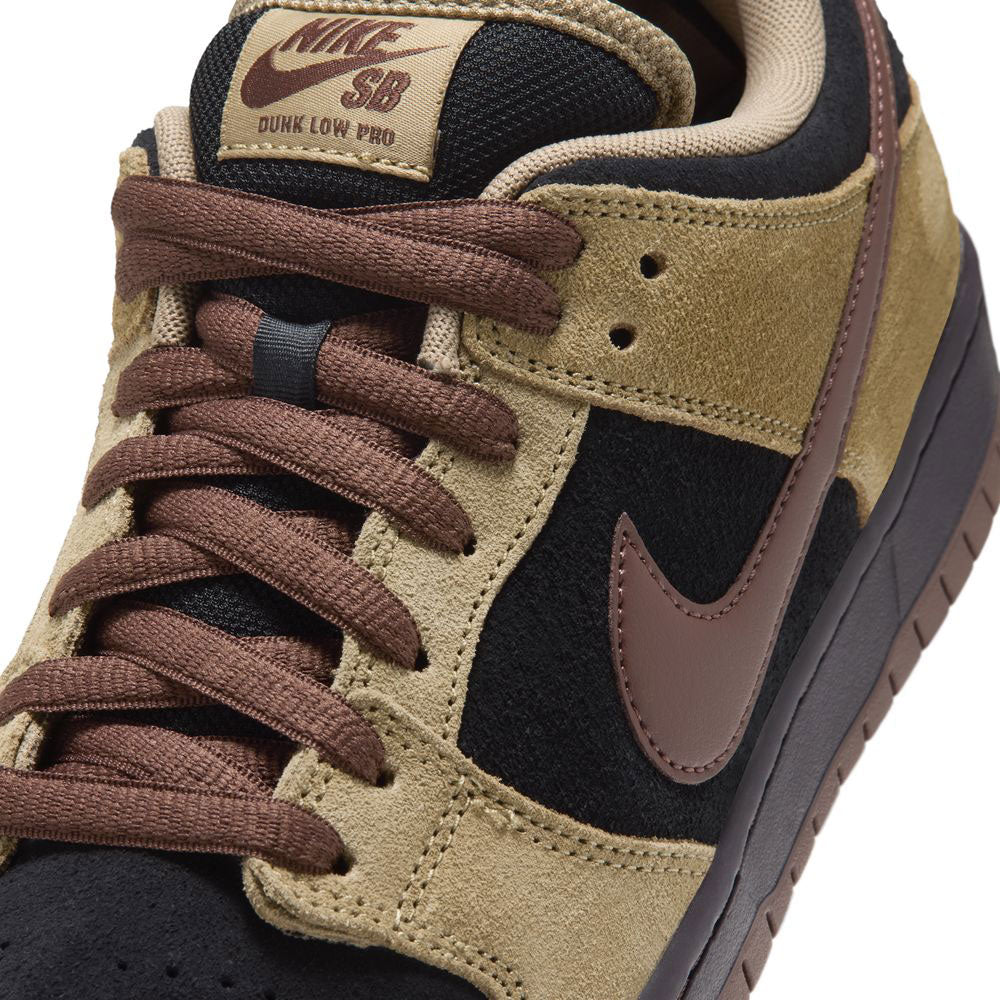 Close-up of the Filbert Light Chocolate Black Burgundy Ash Dunk Low Pro HQ1625201 Nike SB Skateboarding Shoe, showcasing tan suede overlays, black mesh panels, brown laces, and a brown Nike swoosh. The tongue tag features the Nike SB logo in brown lettering.