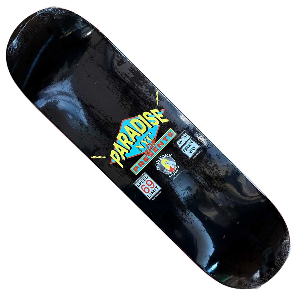 The Flashdance Paradise Deck 8.5x32.1 Skateboard is a black wood deck made in Mexico, featuring large yellow and blue PARADISE NYC lettering, DEPARTMENT in red below, plus small graphics like "Speed Limit 69" and a cartoon bomb.