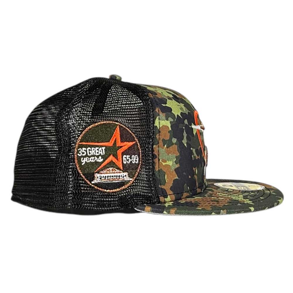 The Fleck Black True Houston Astros New Era 5950 Fitted Hat features a camouflage and black mesh design, an orange "35 GREAT YEARS 65-99" star patch above a white building graphic, front embroidery, and a round sticker on the flat brim.