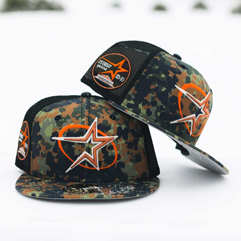 Two Fleck Black True Houston Astros New Era 5950 fitted hats are stacked, each with an orange heart and white outlined star on the front and a Southern Speak patch on the side, evoking a classic Houston Astros look.