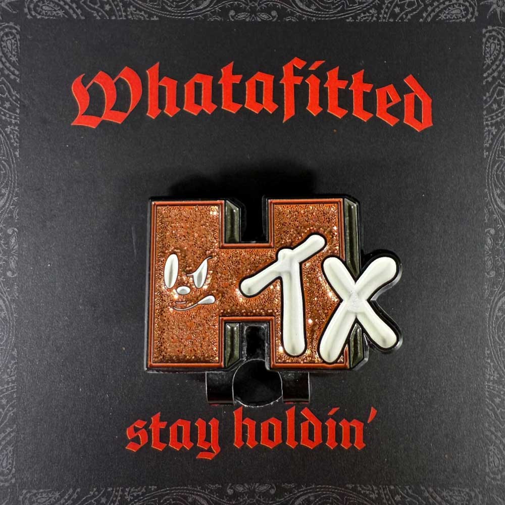 A glittery H-TX pin with a cartoon face on the H sits on black, with "Whatafitted" and "stay holdin" in red—capturing the spirit of the Fleck Black True Houston Astros New Era Hat 5950 Fitted 5950 Day.