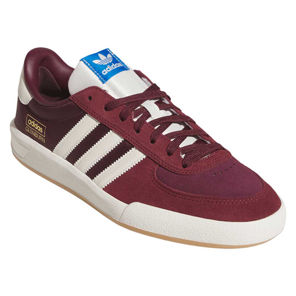 The Glenburn Burgundy White KJ5048 Adidas Skateboarding Shoes feature a maroon and white color scheme with three signature white stripes, gold logo accents, a blue tongue label, and a light brown sole—making them both stylish and durable for skateboarding.