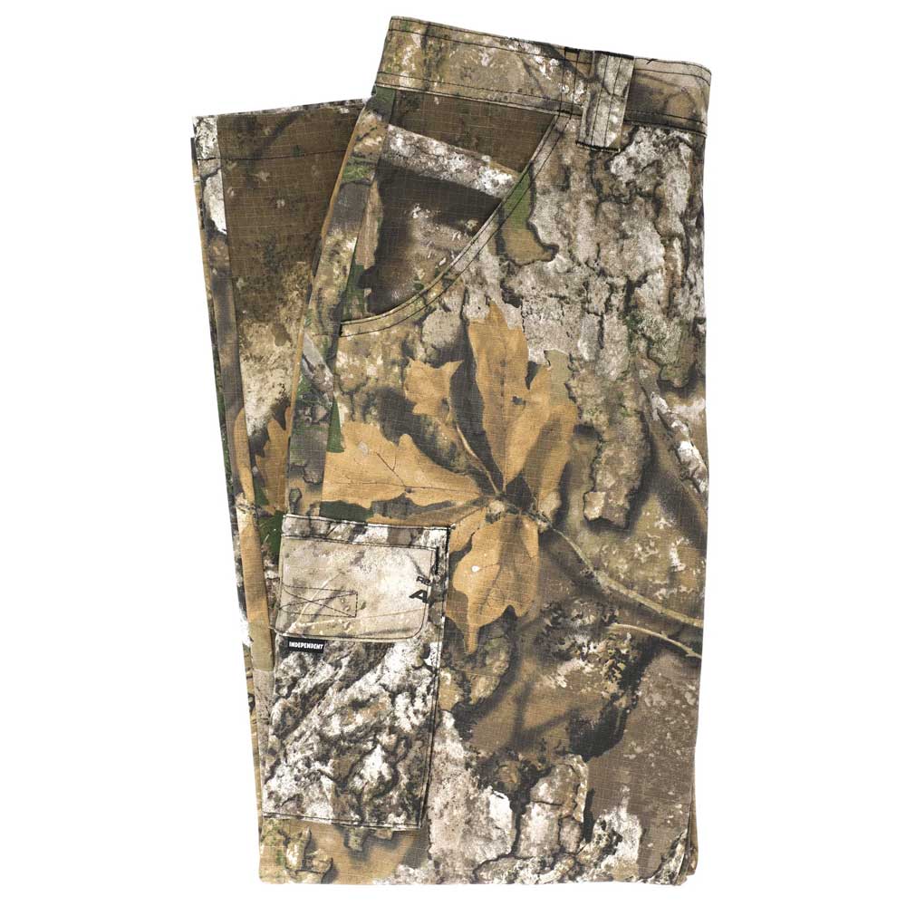 Groundwork 2 Cargo Pants Realtree APX Bottom Mens Independent—folded camouflage cargo pants showcasing authentic leaf and bark patterns in brown, green, and gray hues. Crafted with durable ripstop fabric, these pants feature visible back and front pockets in the distinctive REALTREE colorway.