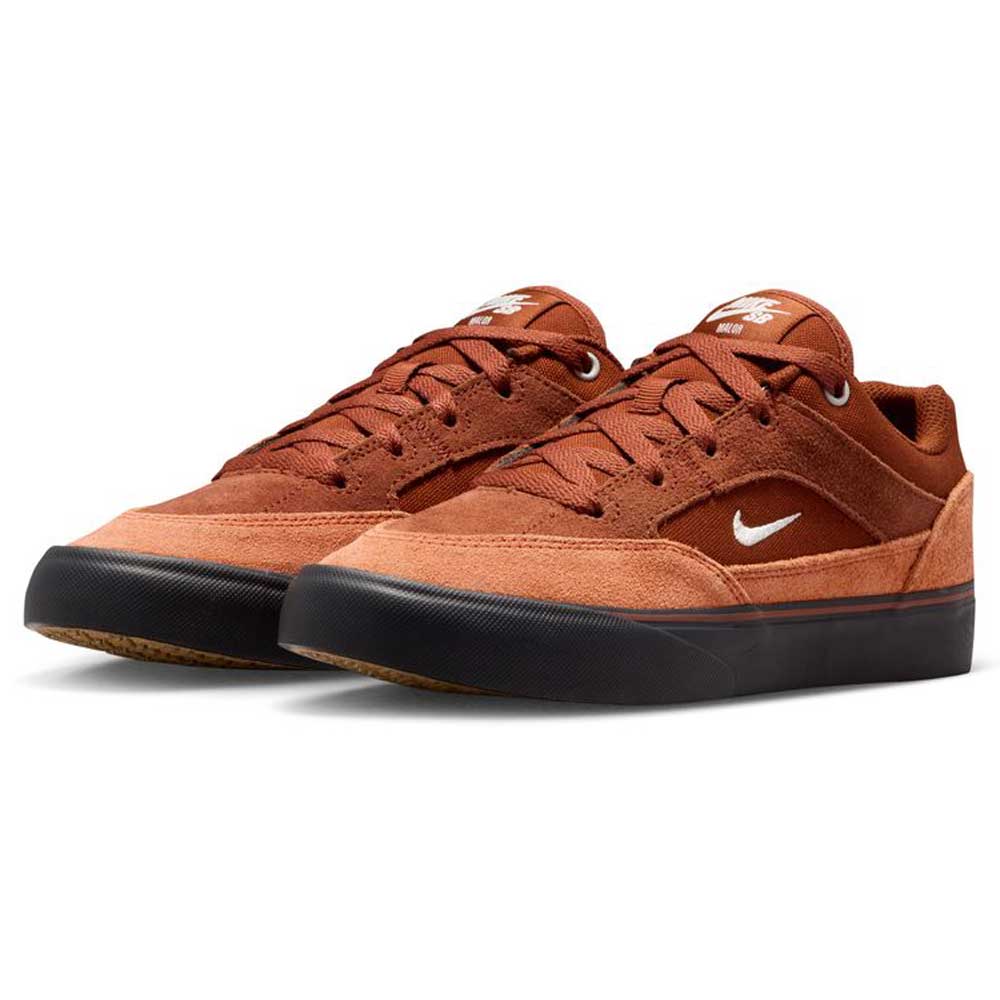 A pair of HF1205200 Cinnamon Light Bone YOUTH Malor GS Nike SB shoes for kids, featuring suede uppers, black rubber soles, and white Nike swooshes, displayed on a white background.