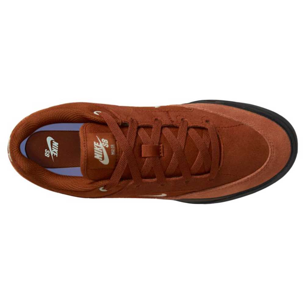 Top view of the HF1205200 Cinnamon Light Bone YOUTH Malor GS Nike SB skate shoe featuring a brown suede upper, black sole, white Nike logos on insole and tongue, brown laces, and detailed stitching for everyday wear.