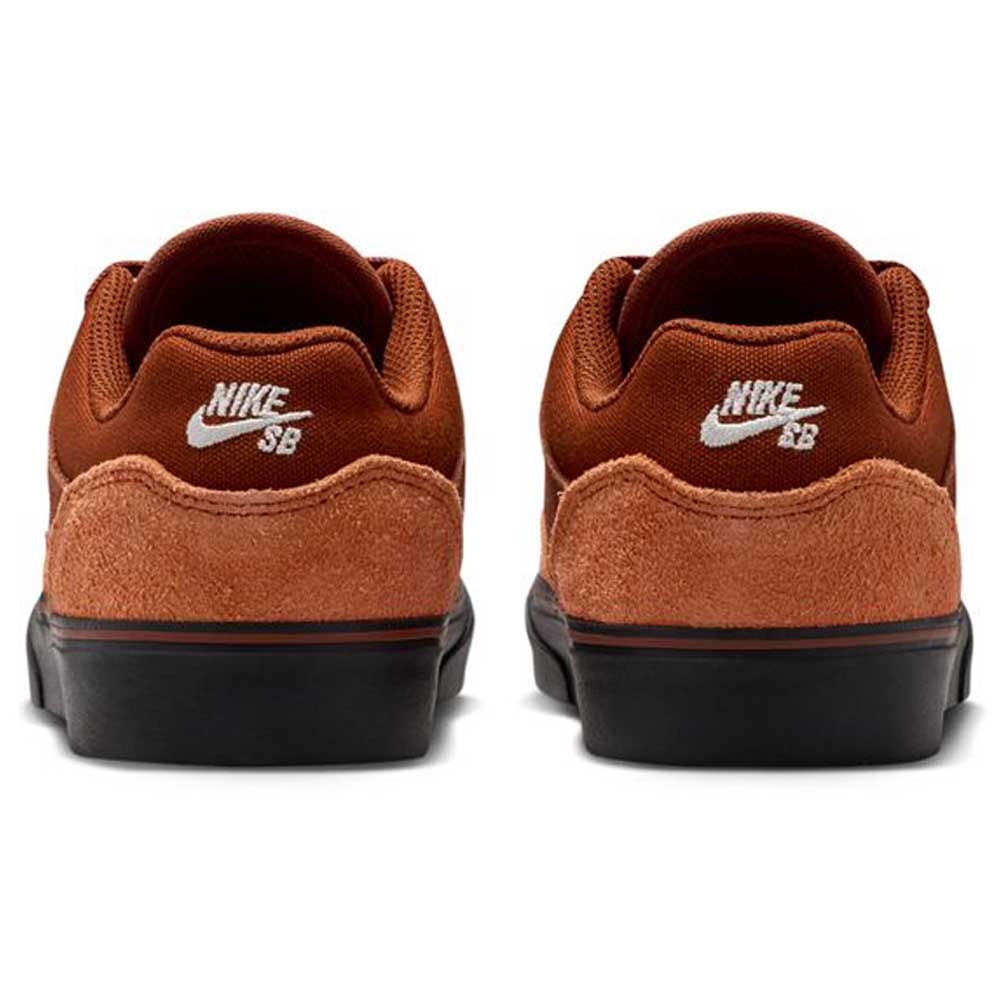 The HF1205200 Cinnamon Light Bone YOUTH Malor GS Nike SB Shoes feature brown suede uppers, black outsoles, and a white Nike SB logo embroidered on the heel—a durable and stylish choice for any skate shoe collection.