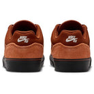 The HF1205200 Cinnamon Light Bone YOUTH Malor GS Nike SB Shoes feature brown suede uppers, black outsoles, and a white Nike SB logo embroidered on the heel—a durable and stylish choice for any skate shoe collection.