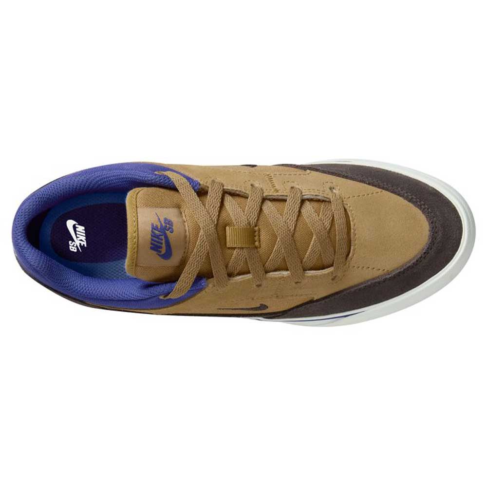 Top view of the Nike SB Malor GS (HF1205700) youth skate shoe in Wheat Velvet Brown/Deep Night, featuring a purple inner lining, brown laces, dark brown toe, white sole, and visible Nike logos—ideal for durable kids’ skate style.