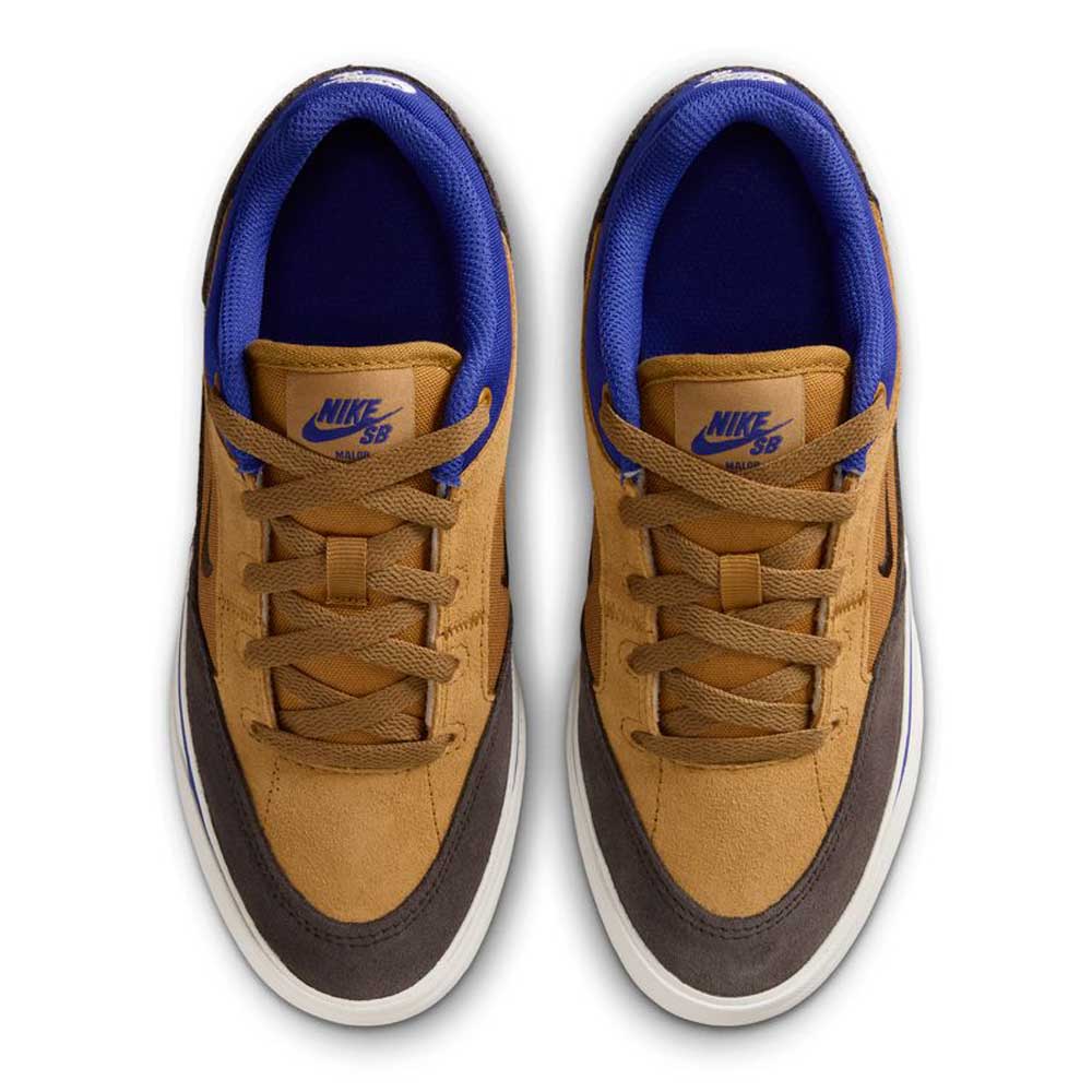 Top view of HF1205700 Wheat Velvet Brown Deep Night YOUTH Malor GS Nike SB shoes, featuring brown suede uppers, dark accents, blue lining, white soles, and blue Nike SB logos on the tongues—durable and stylish skate footwear for kids.