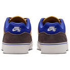Back view of two HF1205700 Wheat Velvet Brown Deep Night YOUTH Malor GS Nike SB shoes featuring brown suede heels, blue mesh at the ankle, yellow lining, white rubber soles, and white Nike SB logos on the back.