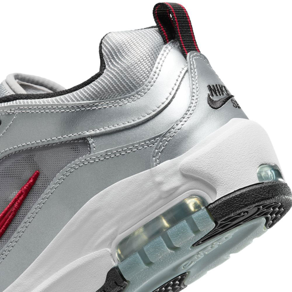 Close-up of the heel and midsole of the HF3062001-Silver-Bullet-Air-Max-Ishod-Wair-Leather-Suede-Shoes, featuring red pull tab, red Swoosh, black Nike branding, visible Max Air tech, and a white/black outsole—skate-inspired cushioning.