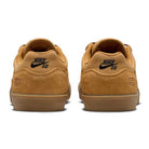 Two Wheat Gum Light Brown Black White Malor TE Nike SB shoes (HF3066701) are shown from the back, featuring the black Nike SB logo on the heels and “58” stitched above the soles to highlight their durable skate shoe design.