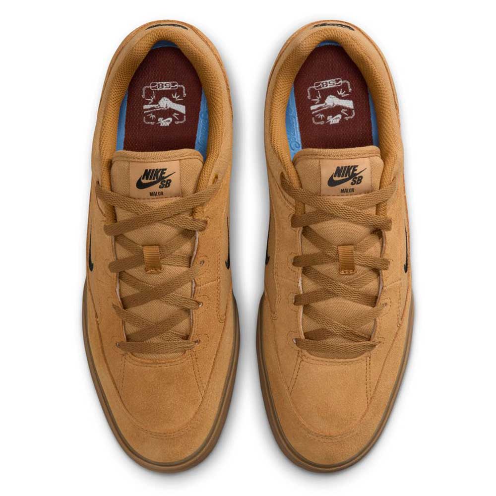 A pair of HF3066701 Wheat Gum Light Brown Black White Malor TE Nike SB shoes viewed from above, featuring brown insoles with white graphics, tan laces, and black Nike logos on the tongues, offering a durable, skate-inspired design.