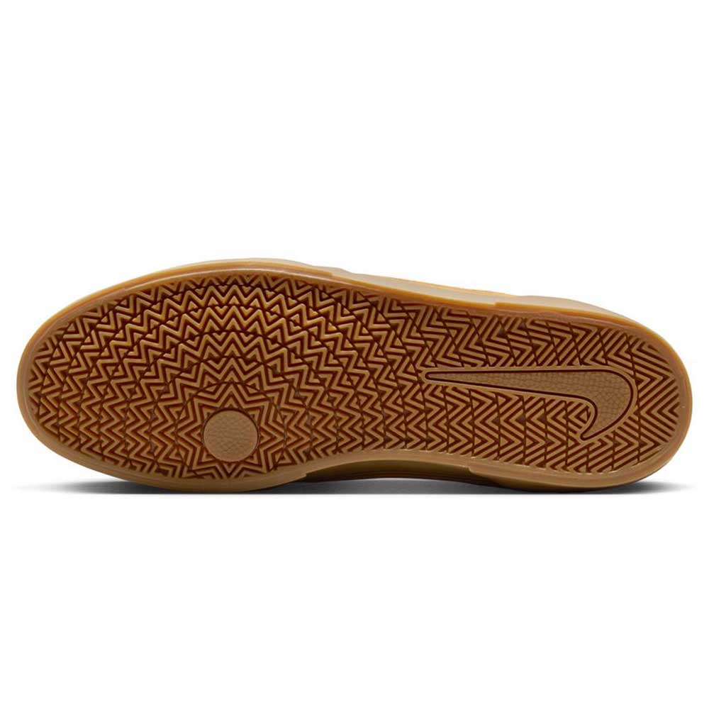 The image shows the sole of the HF3066701 Wheat Gum Light Brown Black White Malor TE Nike SB, featuring a herringbone tread and Nike swoosh near the heel, designed for durable skateboarding performance.
