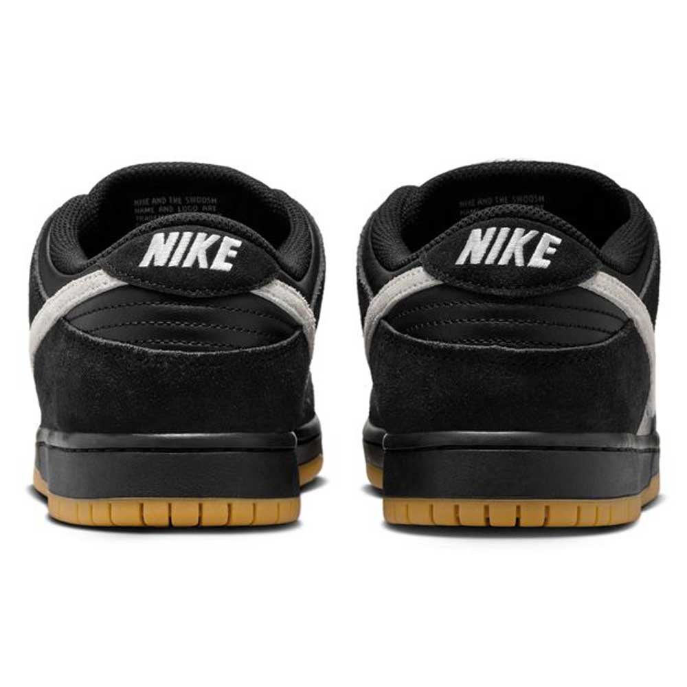 The HF3704003 Black White Nike SB Dunk Low Pro Suede Leather Shoes feature suede accents, white Nike heel branding, black midsoles, and light brown gum outsoles—ideal skateboarding sneakers for daily style.