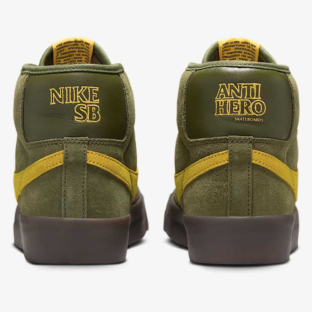 The HM5838300 Anti Hero Rough Green Amarillo Blazer Mid Nike SB suede skateboard shoes feature brown soles, yellow detailing, and branding on the heels: yellow NIKE SB on the left and ANTI HERO SKATEBOARDS on the right.