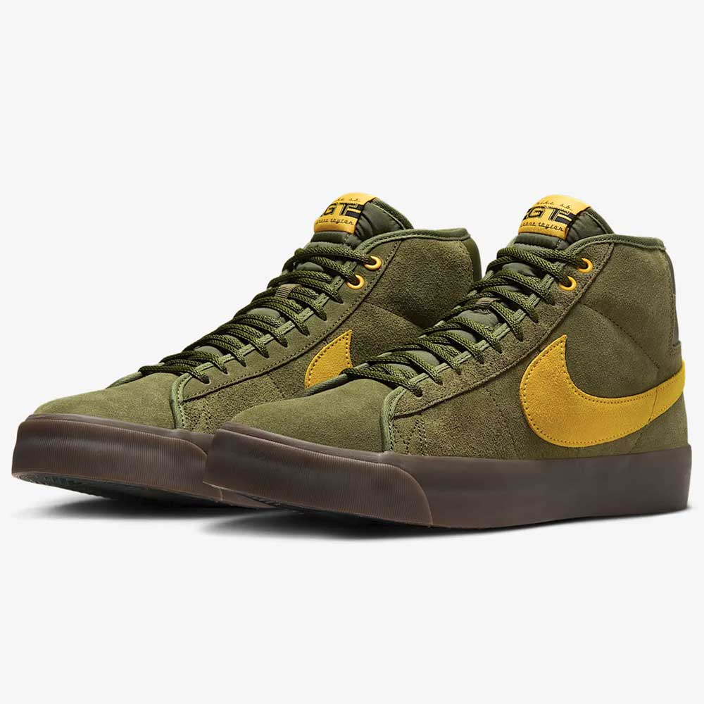 The HM5838300 Anti Hero Rough Green Amarillo Blazer Mid Nike SB suede skateboard shoes feature yellow swooshes, yellow tongue labels, and dark brown rubber soles, shown as a high-top pair on a plain white background.