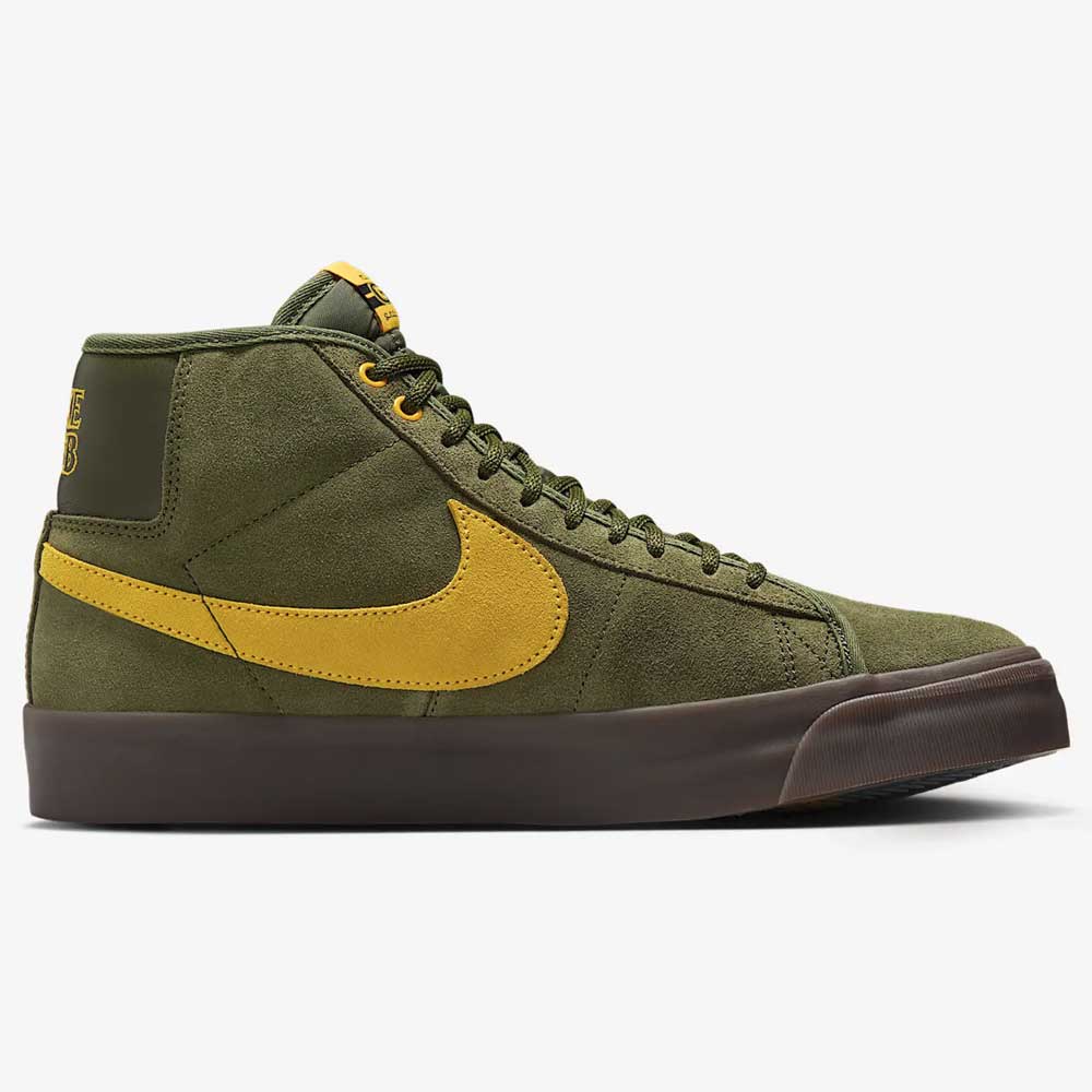 The HM5838300 Anti Hero Rough Green Amarillo Blazer Mid Nike SB suede skateboard shoe features a green upper, yellow Swoosh, yellow accents on the tongue and heel, green laces, and a dark brown rubber sole, shown in side profile.