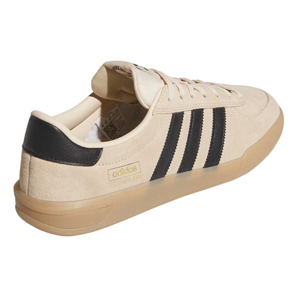 The HP3510 Tan Black Glenburn Adidas Skateboarding Suede Shoes feature a beige suede upper, black stripes, black heel accent, gum sole, and gold Adidas logo—blending classic style with streetwear edge in a sleek design.