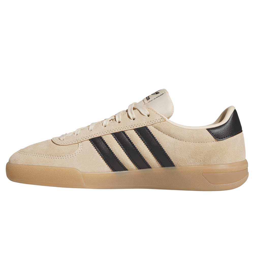 The HP3510 Tan Black Glenburn Adidas Skateboarding Suede Shoes feature a beige suede upper, black stripes, and a tan rubber sole. With their classic, minimalist design, these sneakers are ideal for any streetwear style.