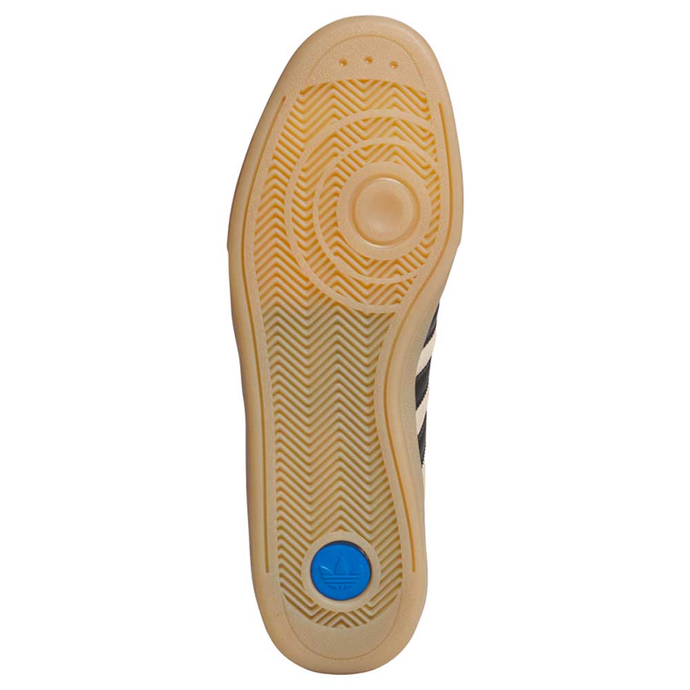 The image displays the sole of the HP3510 Tan Black Glenburn Adidas Skateboarding Suede Shoes, featuring a tan rubber outsole with herringbone tread, circular grip patterns, and a blue adidas logo near the heel—ideal for skateboarding style.