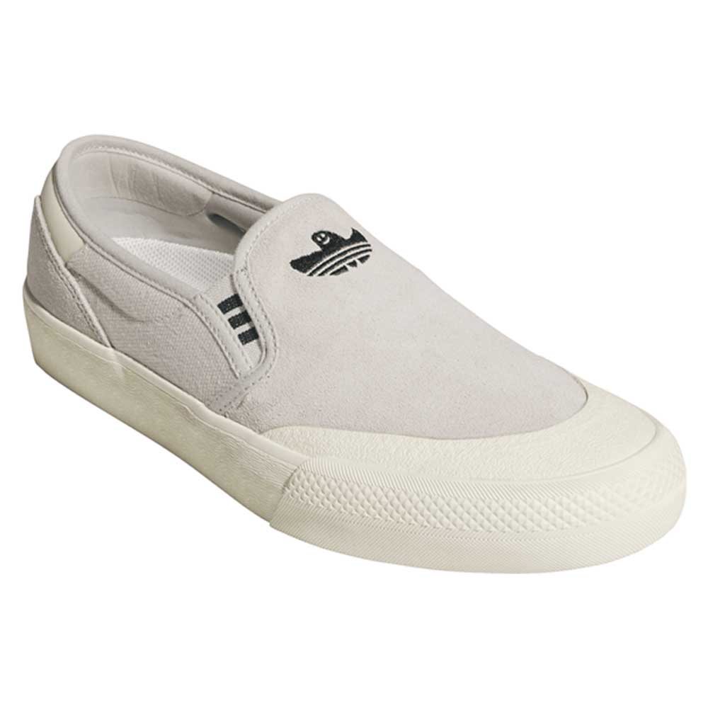 The HQ4721 Gray White Shmoofoil Slip RX Adidas Skateboarding Suede Shoes feature a light gray suede upper, white rubber sole, side stripes, and a black embroidered logo for classic style and comfort in everyday wear.