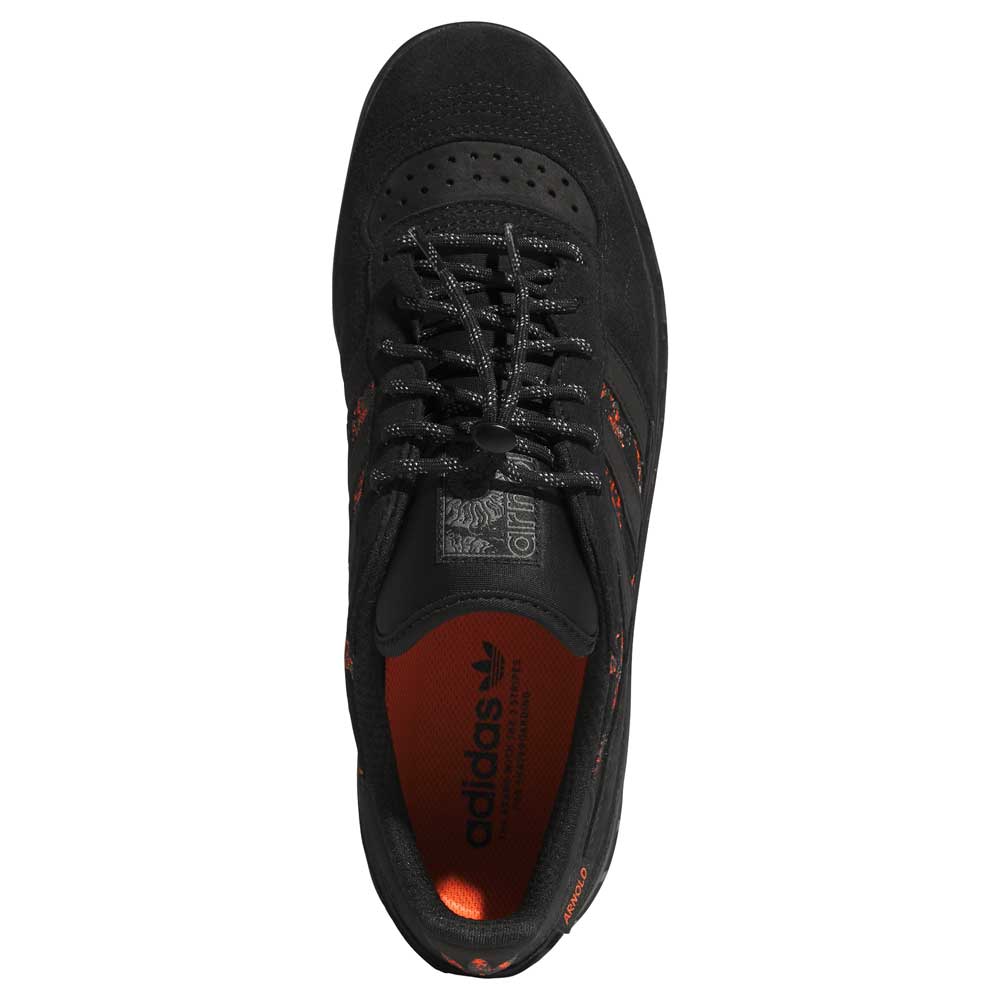 Top view of Handball Top x Mike Arnold Shoes Core Black Suede by Adidas Skateboarding, featuring black laces, orange inner lining and accents. Adidas logo appears on the tongue and insole.