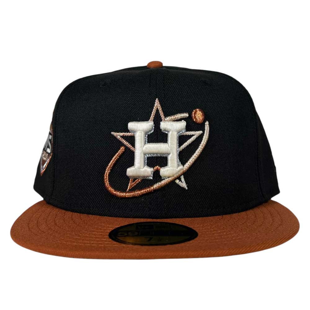 The Harvest Black Space City Houston Astros New Era 5950 Fitted Hat by Whatafitted features a black crown, brown brim, and an embroidered Astros logo on the front—a stylish cap that shows your team pride.