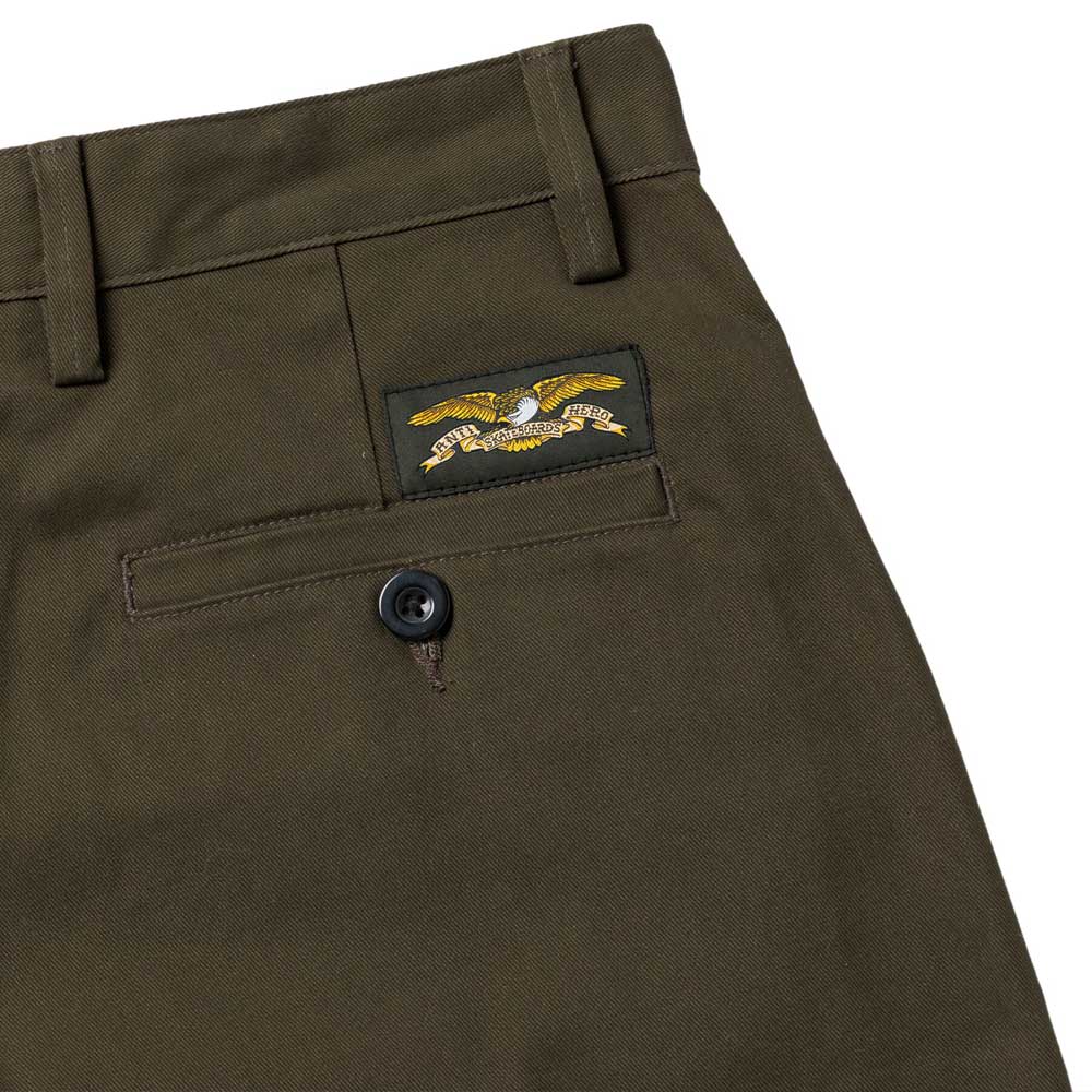 Close-up of Hecho Por Skate Pant Anti Hero Skateboards in Dark Olive, featuring a back pocket with button and eagle patch—ideal for skateboarding and perfect for exclusive Skateshop Day releases.