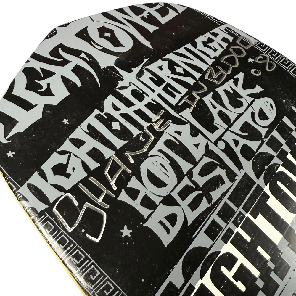 Close-up of the Hightower Coda Skateboards Deck 8.5x31.8 Signed Collectible, featuring bold white graffiti-style text ("NIGHT," "BLACK," "HOTEL") in various sizes for a striking urban look.
