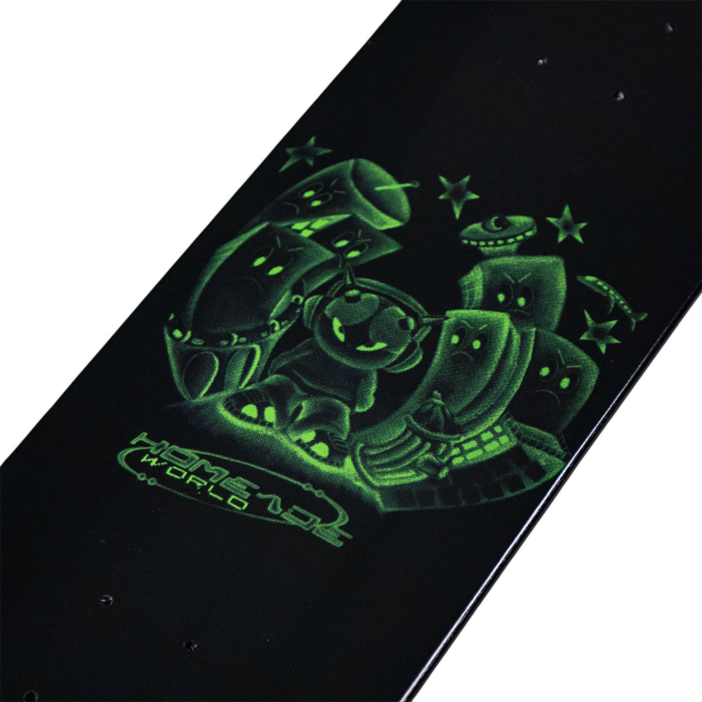 The Black Dipped Full Shape Homemade Skateboards Deck is a 7-ply maple skateboard deck featuring glowing green cartoon-style characters surrounded by stars on a black background, with “Homemade World” text printed below the artwork.